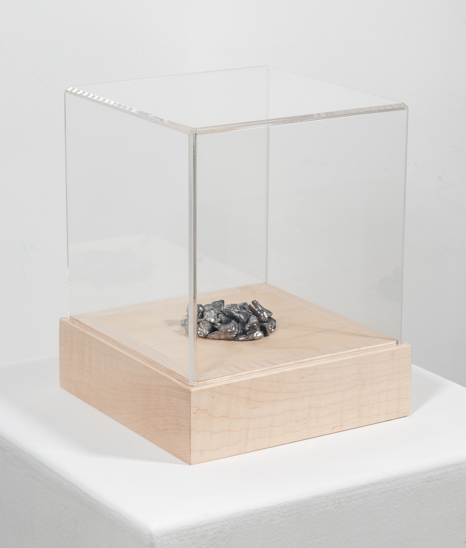 Image of "Thirty Pieces" sculpture depicting a small pile of thirty human teeth cast in lead
