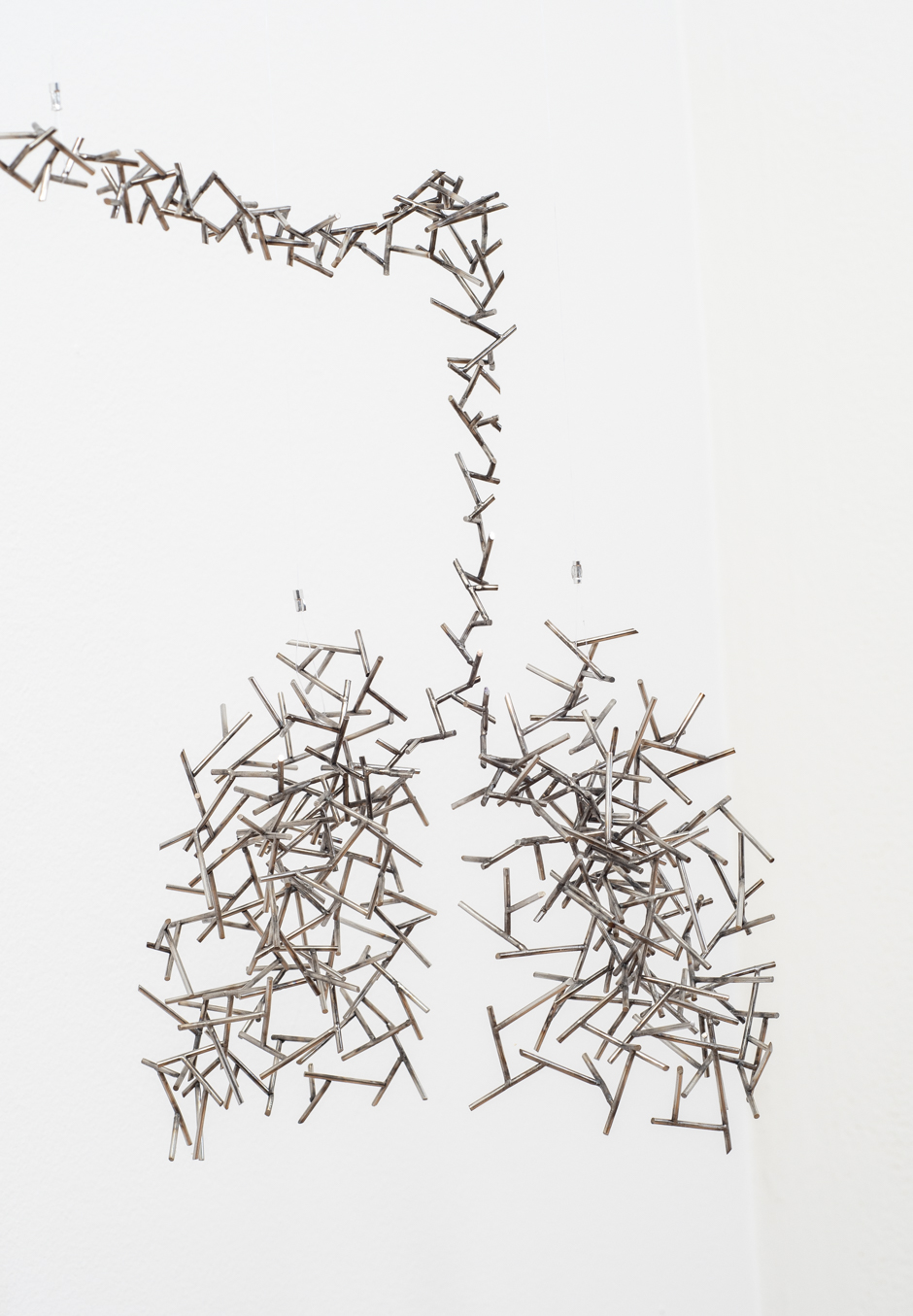 Detail image of "Exchange III" sculpture created from welded stainless steel