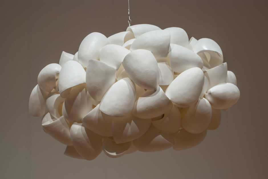 Detail image of suspended "Cloud" sculpture created from cast urethane and stainless steel