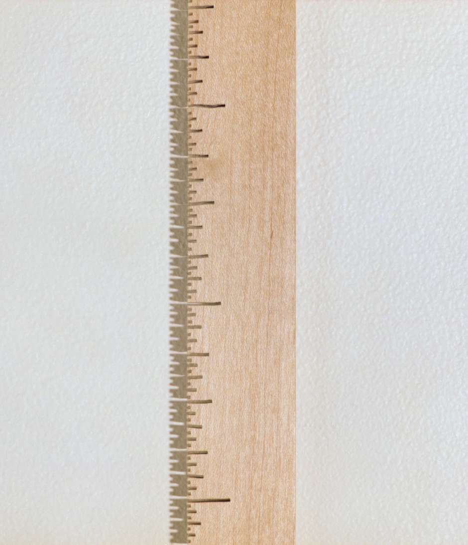 Detail image of wall hung "Measure IV" sculpture created from bandsawn wood