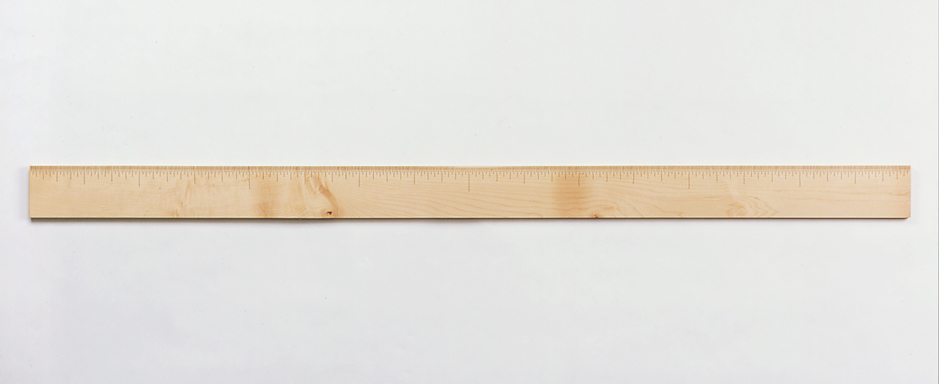 Image of wall hung "Measure X" sculpture created from bandsawn wood