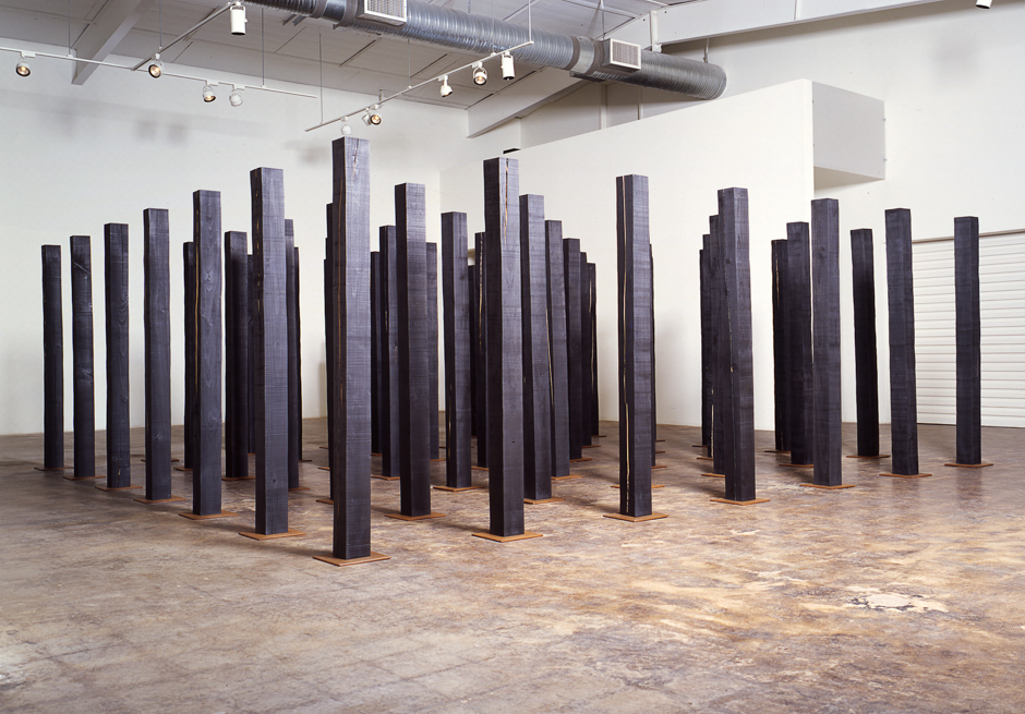 Image of floor standing "Replication Field" sculpture created from bandsawn wood and burnished with graphite